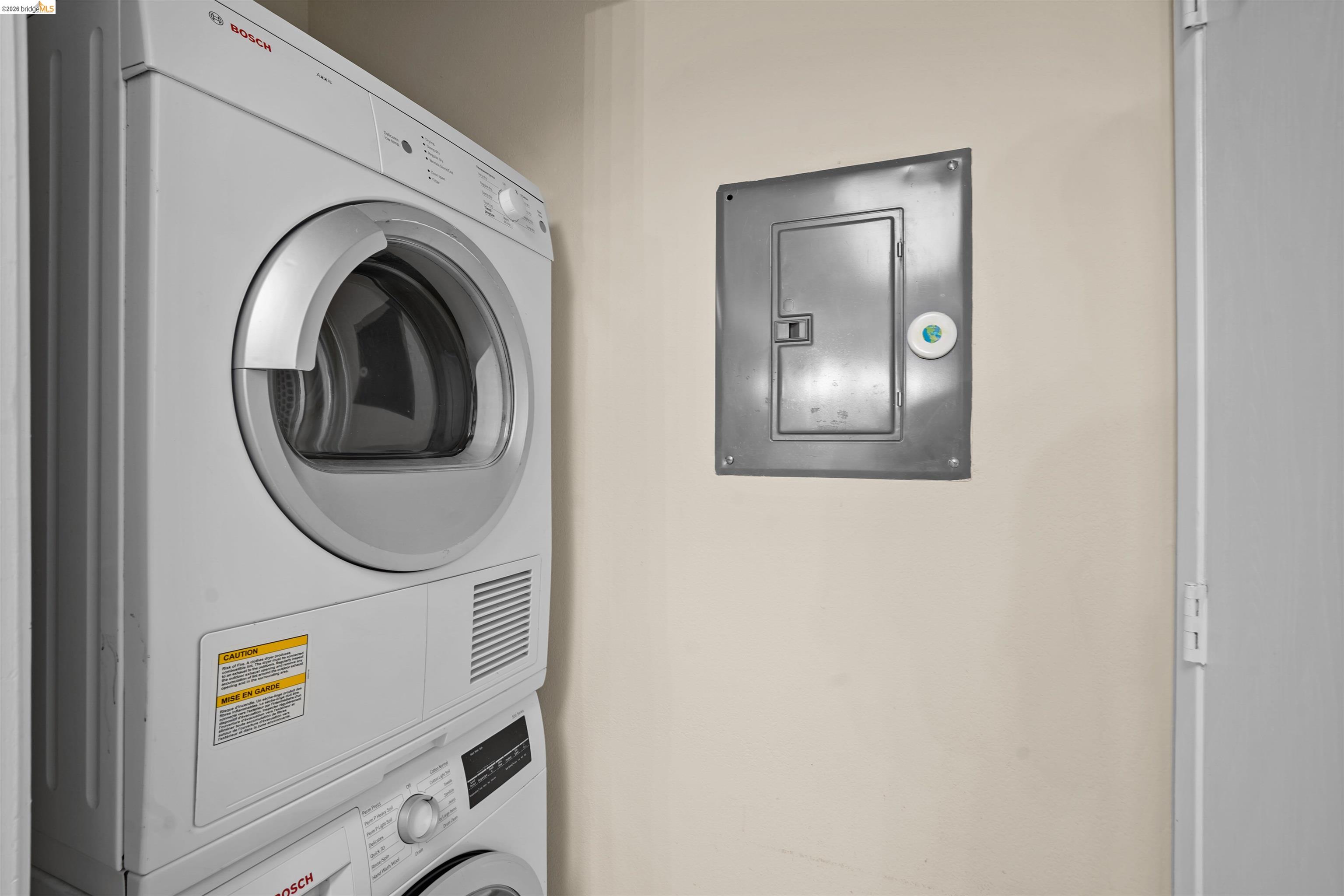 1505 Kirker Pass Road, Unit 214 Concord, CA 94521 - Photo 19 of 55 Stacked laundry appliances with a front-loading dryer and a lower front-loading washer