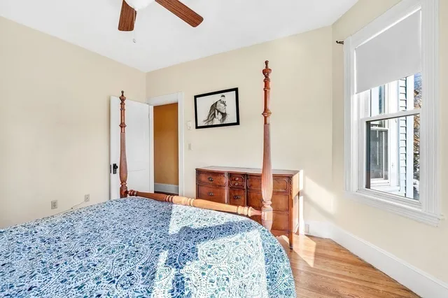 a bedroom with a bed and a television