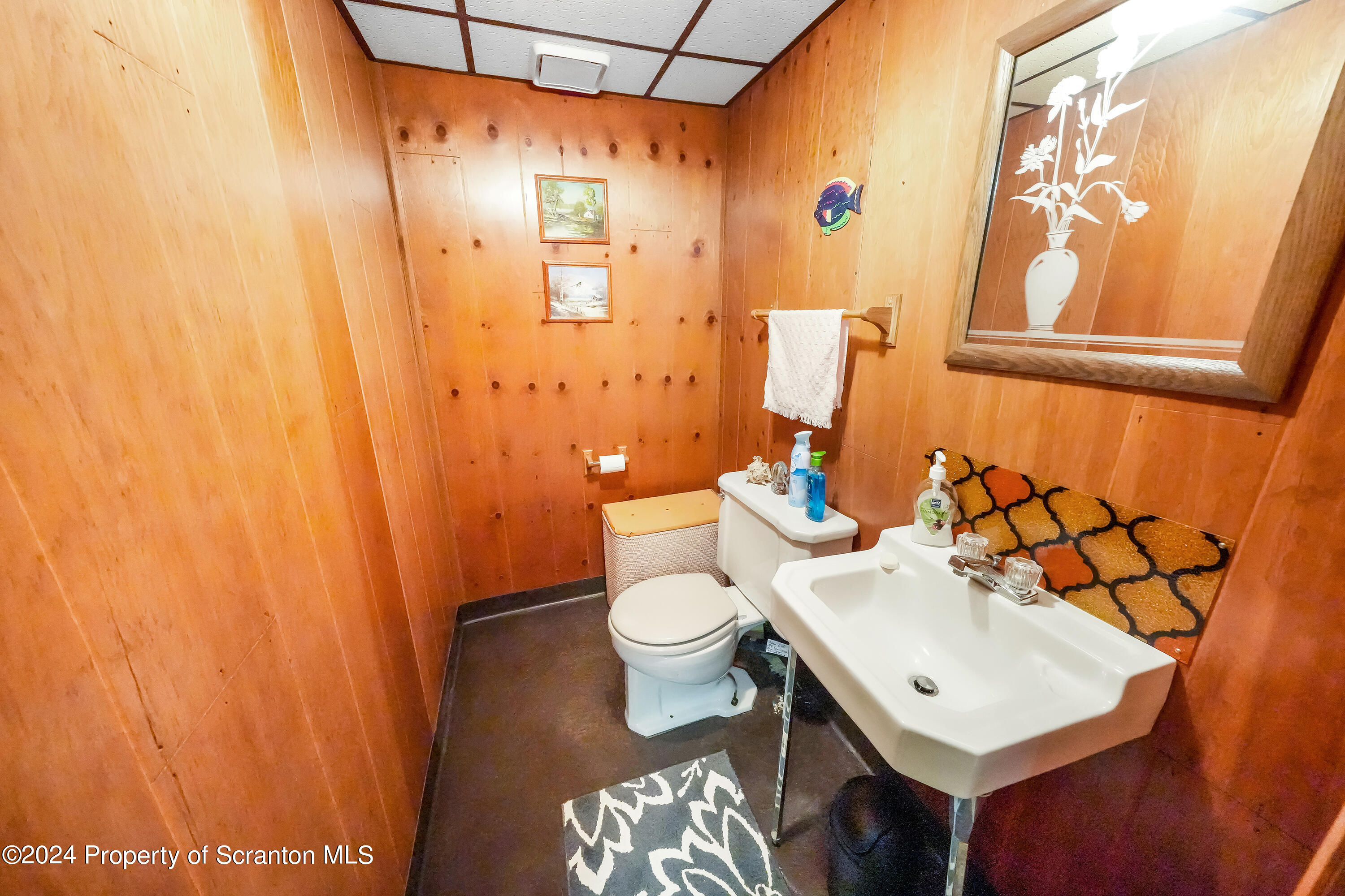 254 Hoover Street Old Forge, PA 18518 - Photo 25 of 27 a white toilet sitting next to a bathroom sink
