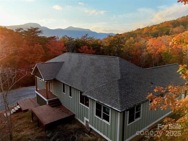 an aerial view of houses with a yard