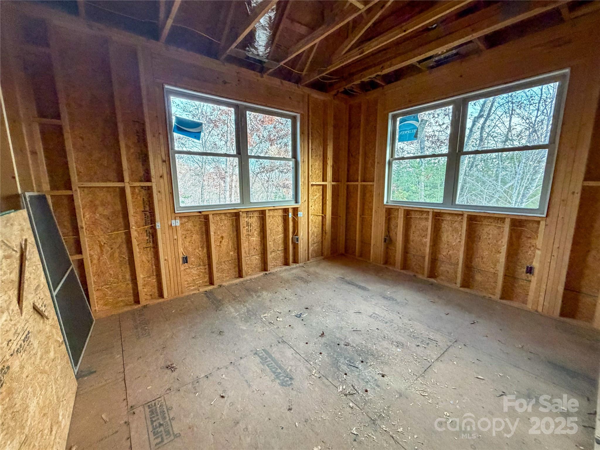 864 Matho Trace Lake Lure, NC 28746 - Photo 14 of 47 a view of an empty room with a window