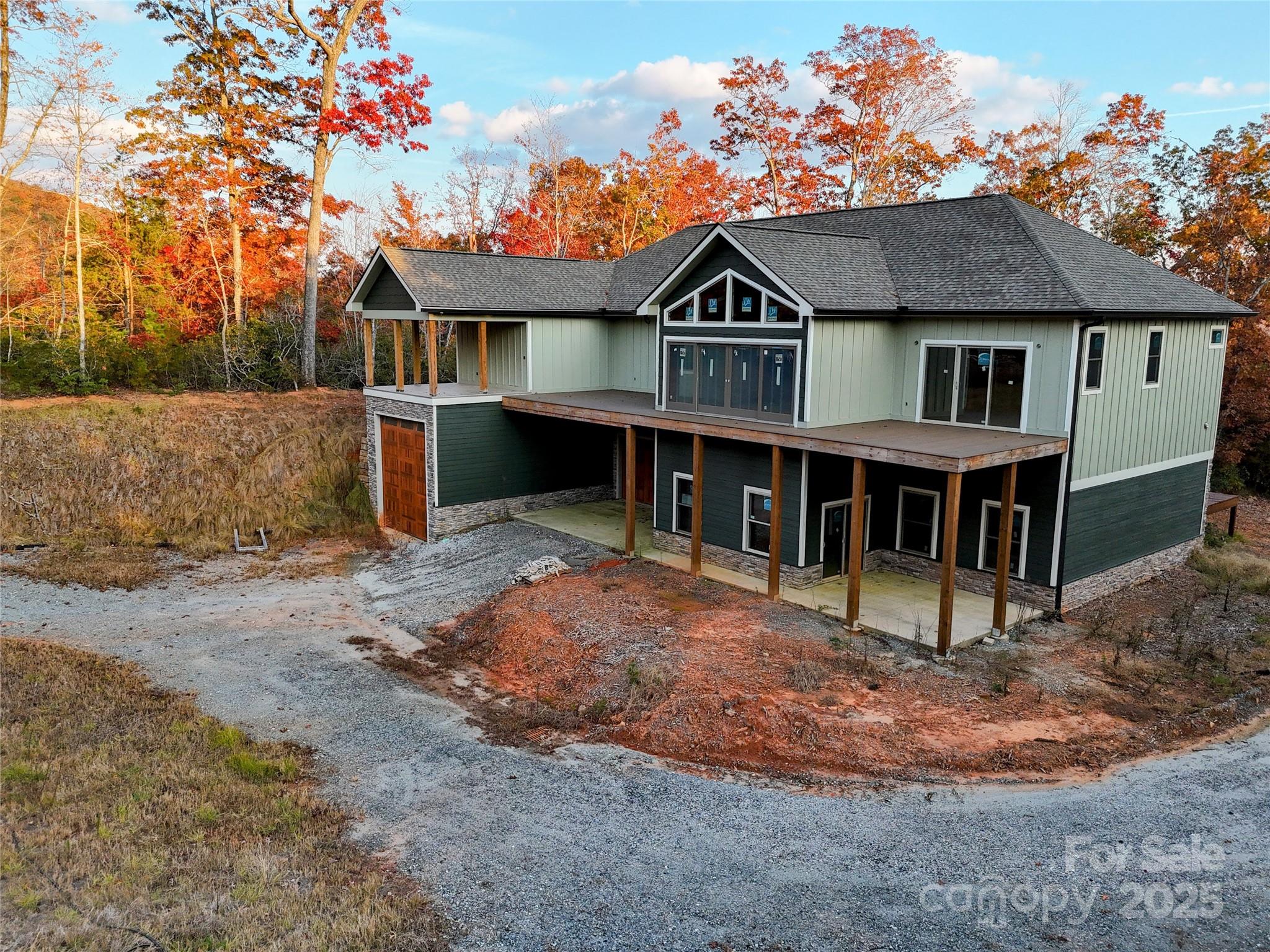864 Matho Trace Lake Lure, NC 28746 - Photo 15 of 47 a view of house with outdoor space and sitting area