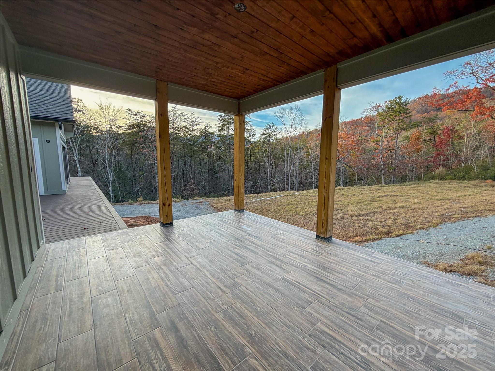 864 Matho Trace Lake Lure, NC 28746 - Photo 23 of 47 a view of a room with wooden floor and iron stairs