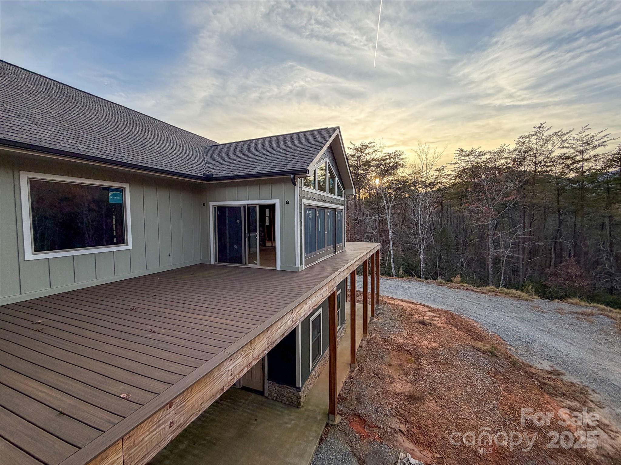 864 Matho Trace Lake Lure, NC 28746 - Photo 31 of 47 a terrace of a house with wooden floor and fence