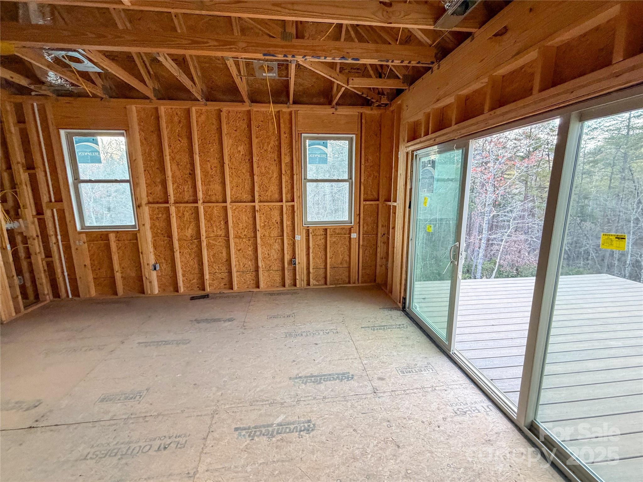 864 Matho Trace Lake Lure, NC 28746 - Photo 32 of 47 a view of an empty room with windows