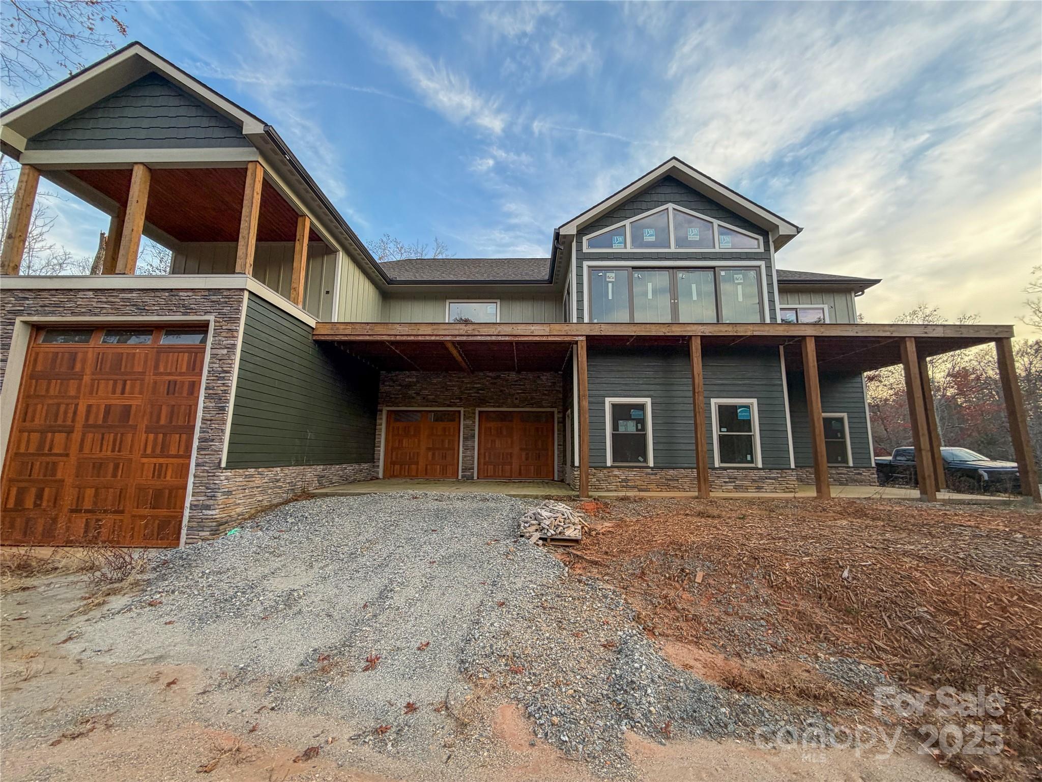 864 Matho Trace Lake Lure, NC 28746 - Photo 38 of 47 a front view of a house with garden