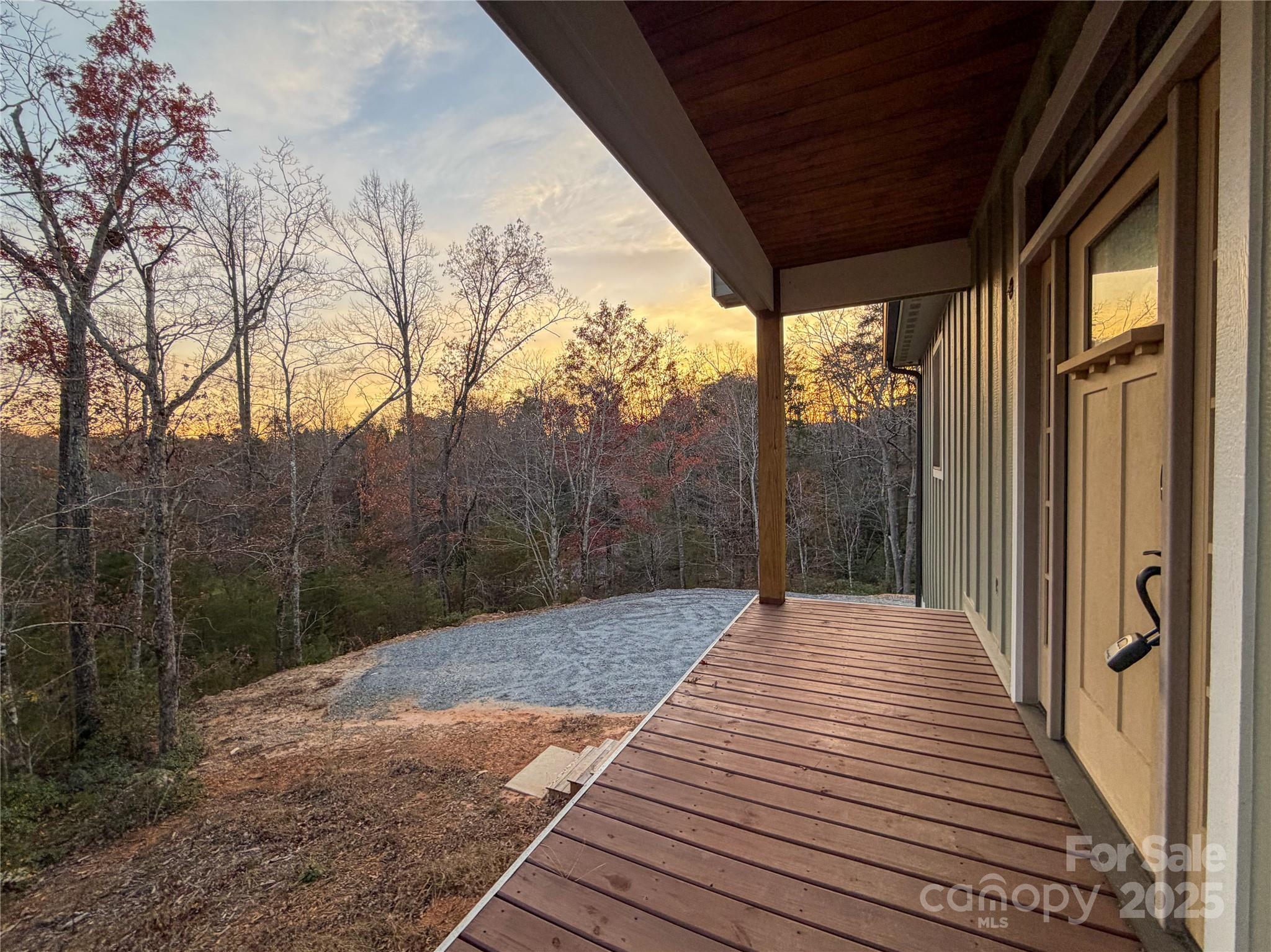 864 Matho Trace Lake Lure, NC 28746 - Photo 40 of 47 a view of backyard with mountain view and wooden floor