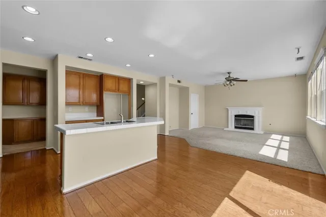 a view of kitchen with cabinets and wooden floor