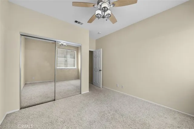 a view of an empty room with a glass door