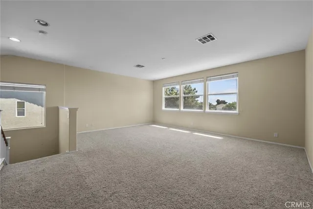 a view of empty room with windows