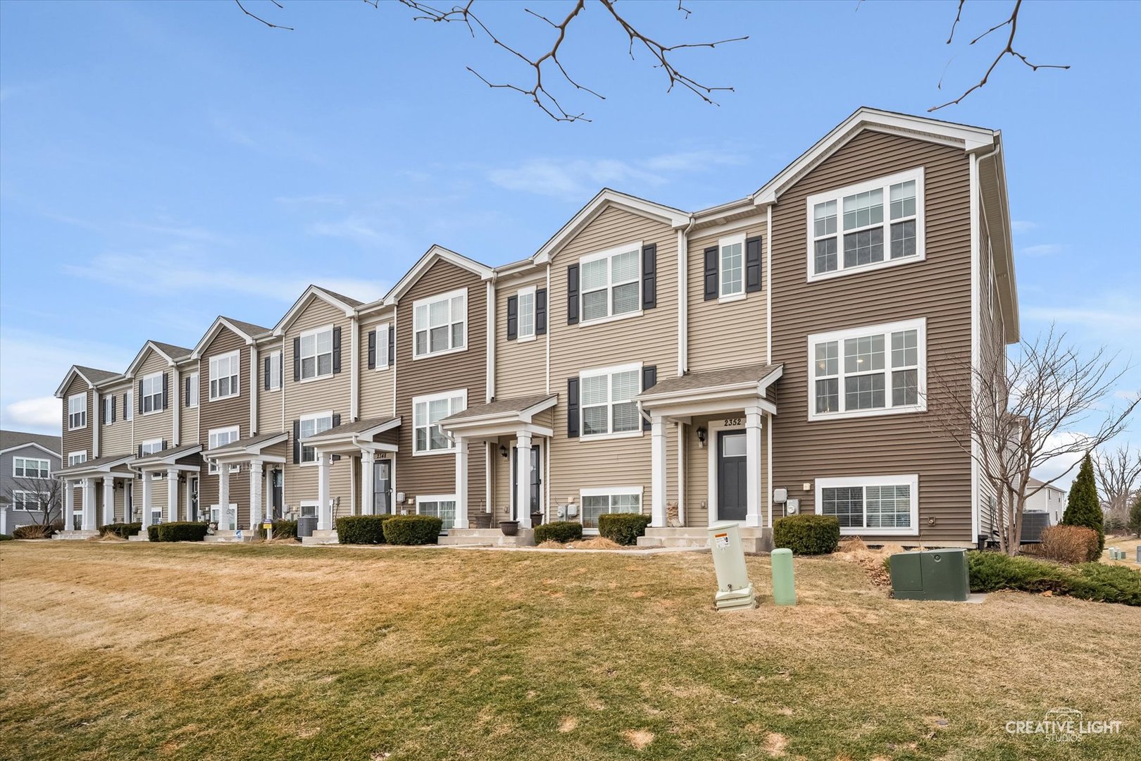 2352 Alison Avenue Pingree Grove, IL 60140 - Photo 1 of 17 a front view of a building with a yard