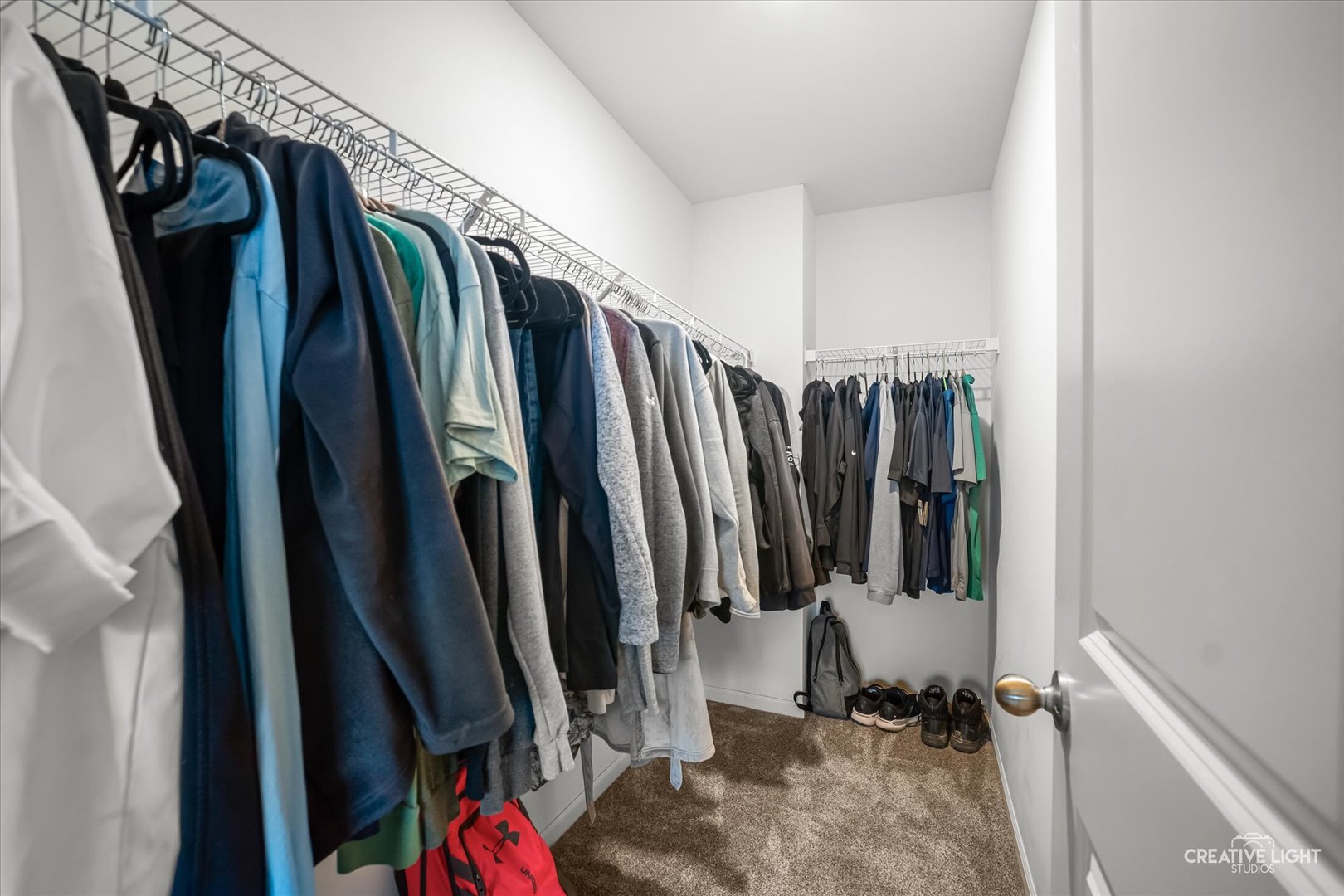 2352 Alison Avenue Pingree Grove, IL 60140 - Photo 11 of 17 a view of walk in closet with clothes and shoes