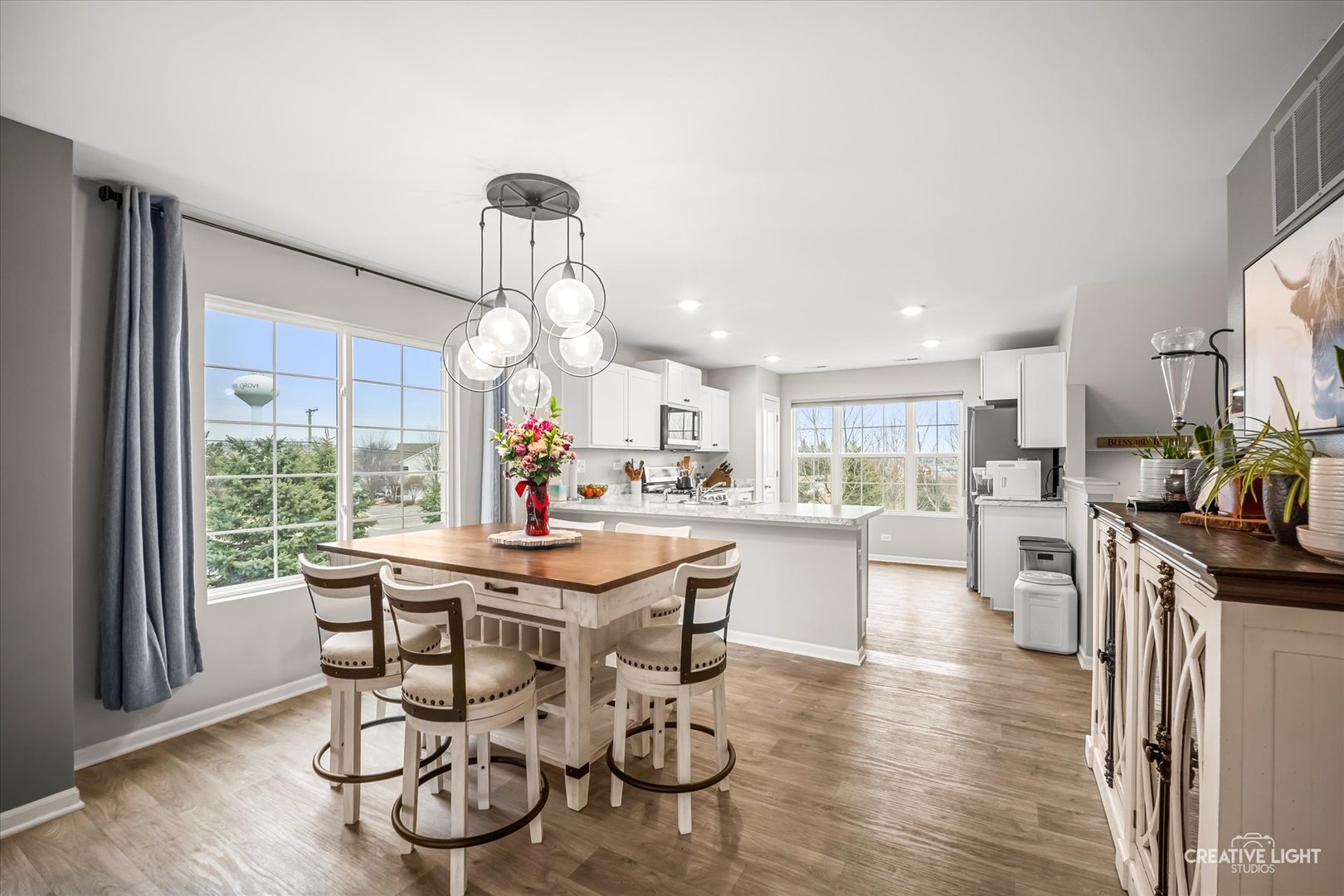 2352 Alison Avenue Pingree Grove, IL 60140 - Photo 5 of 17 a kitchen with stainless steel appliances a dining table chairs and wooden floor