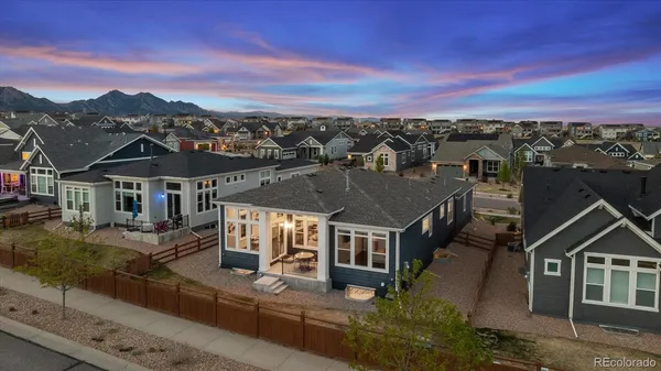 an aerial view of a house with a ocean view