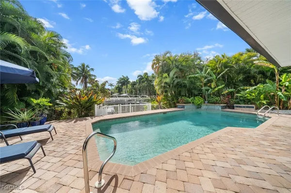 a view of a backyard with sitting area