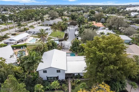 an aerial view of a house with a yard