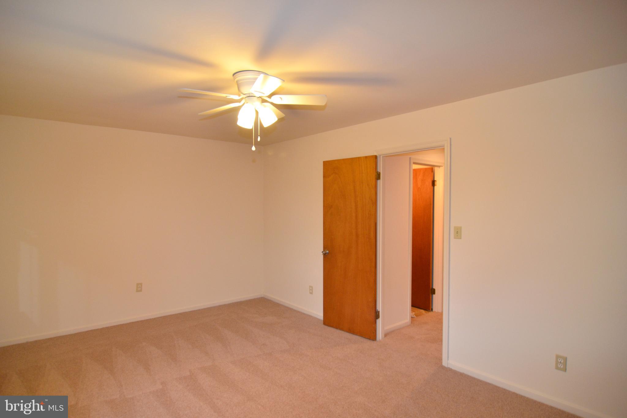 22093 Spring Valley Drive Lexington Park, MD 20653 - Photo 8 of 16 a view of a chandelier fan in a room