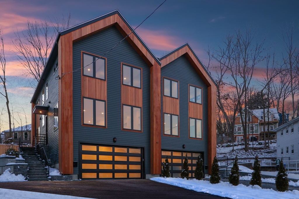 41 Nathan Road, Unit 2 Waltham, MA 02453 - Photo 1 of 2 a front view of a building with glass windows and stairs