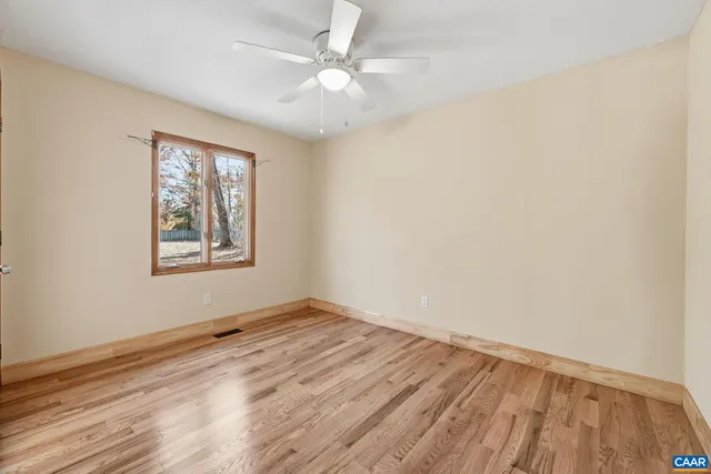 a reading room with furniture window and wooden floor