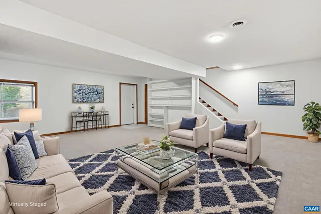 a view of a yard with plants and trees