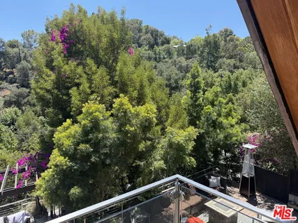 a view of a balcony with plants