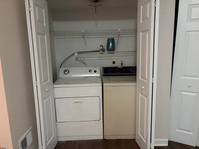 a kitchen with a refrigerator sink and cabinets