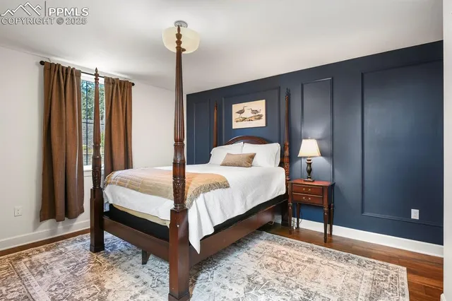 a bedroom with bed and a night stand