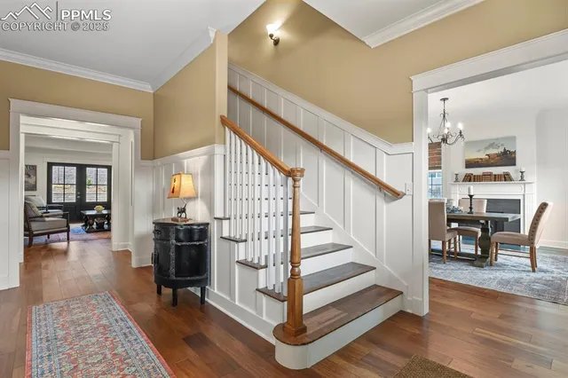 a view of entryway livingroom and hall with wooden floor