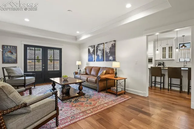 a living room with furniture window and wooden floor