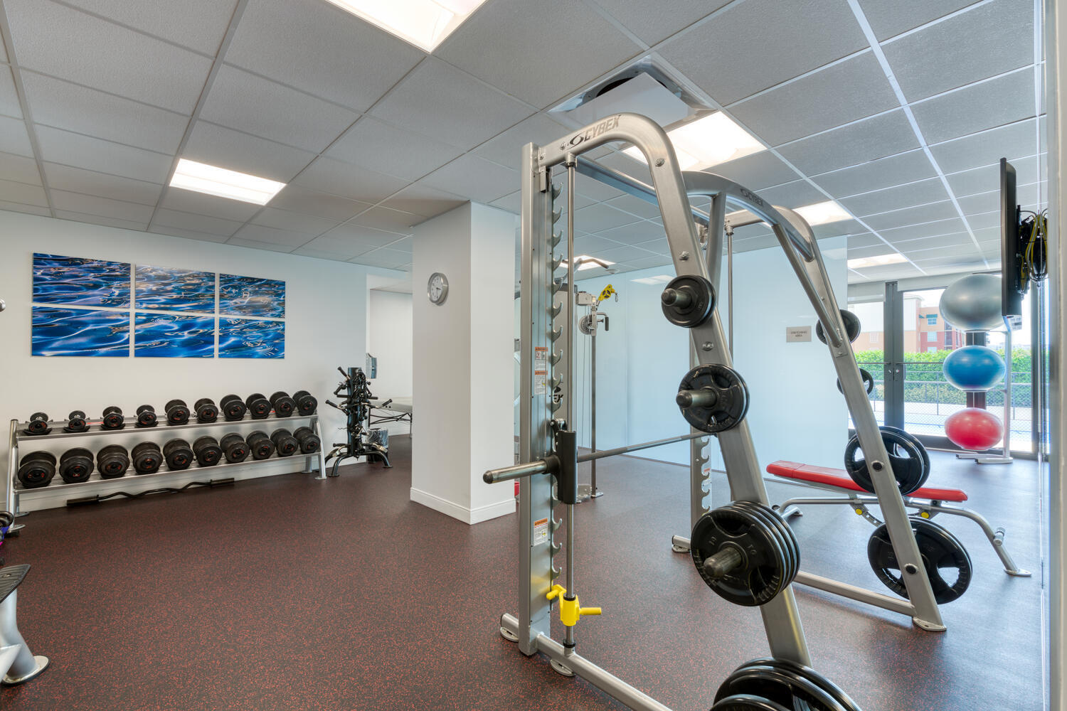 525 South Flagler Drive, Unit 6B West Palm Beach, FL 33401 - Photo 15 of 18 a gym room with gym equipment