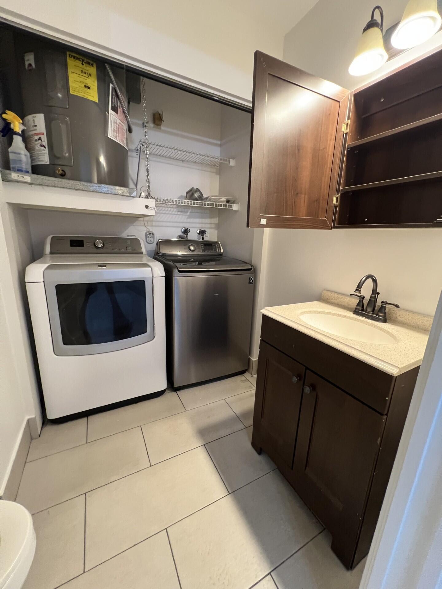 9314 Ketay Circle Boca Raton, FL 33428 - Photo 8 of 22 a kitchen with a sink and a stove top oven