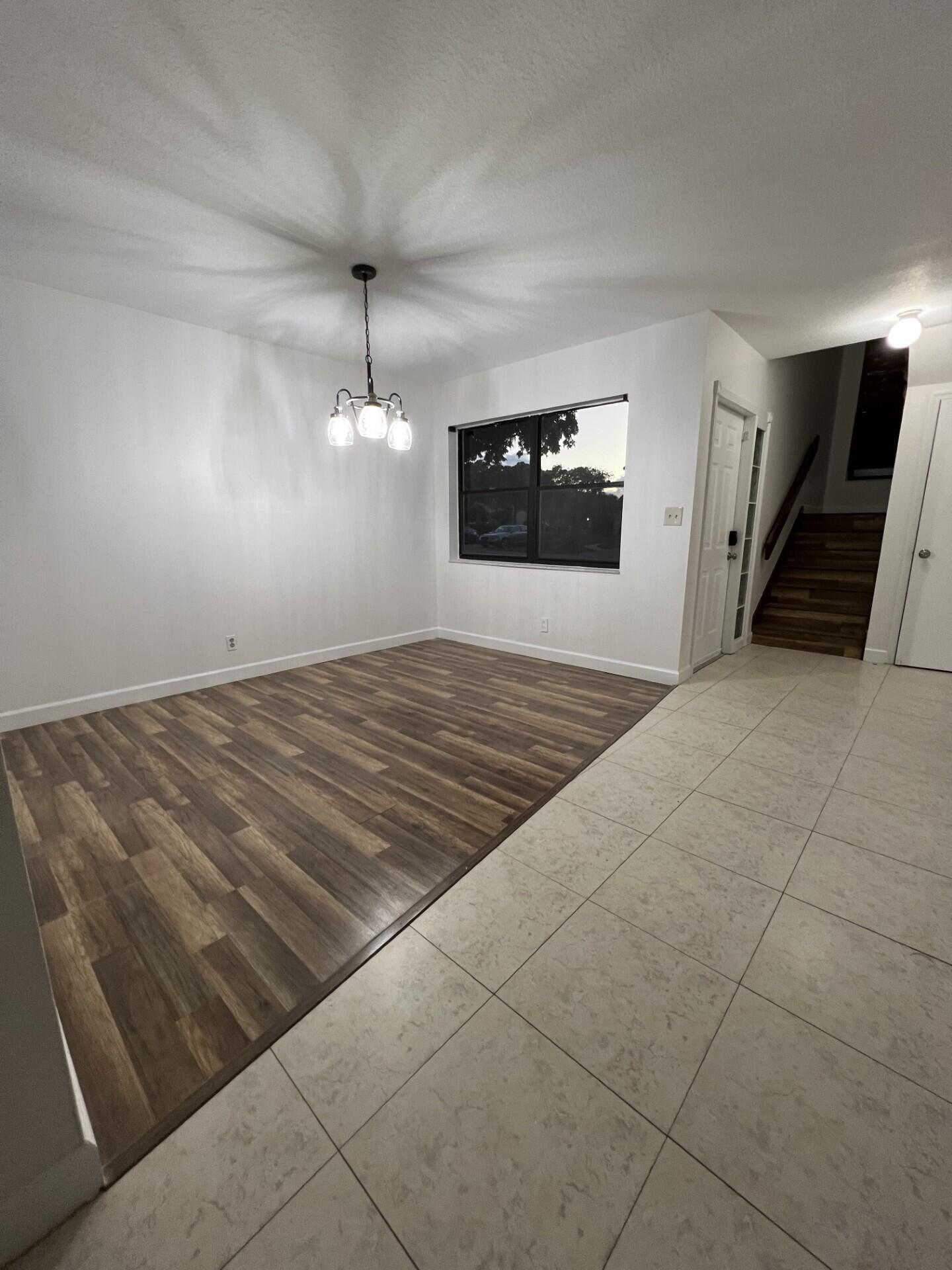 9314 Ketay Circle Boca Raton, FL 33428 - Photo 9 of 22 a view of an empty room and a kitchen