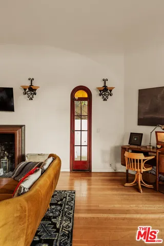 a bedroom with furniture and a fireplace