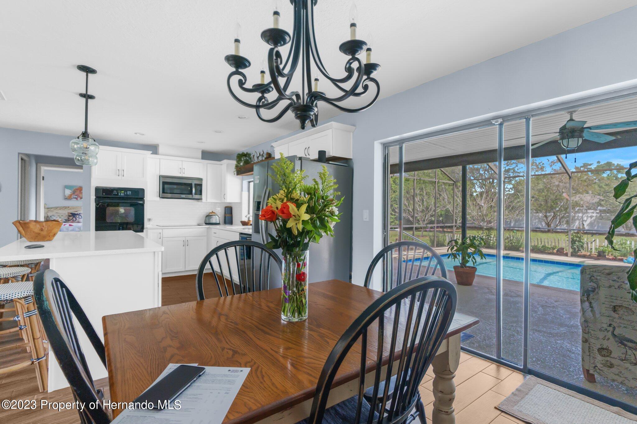 5396 Fern Weeki Wachee, FL 34607 - Photo 18 of 43 a view of a dining room with furniture window and outside view
