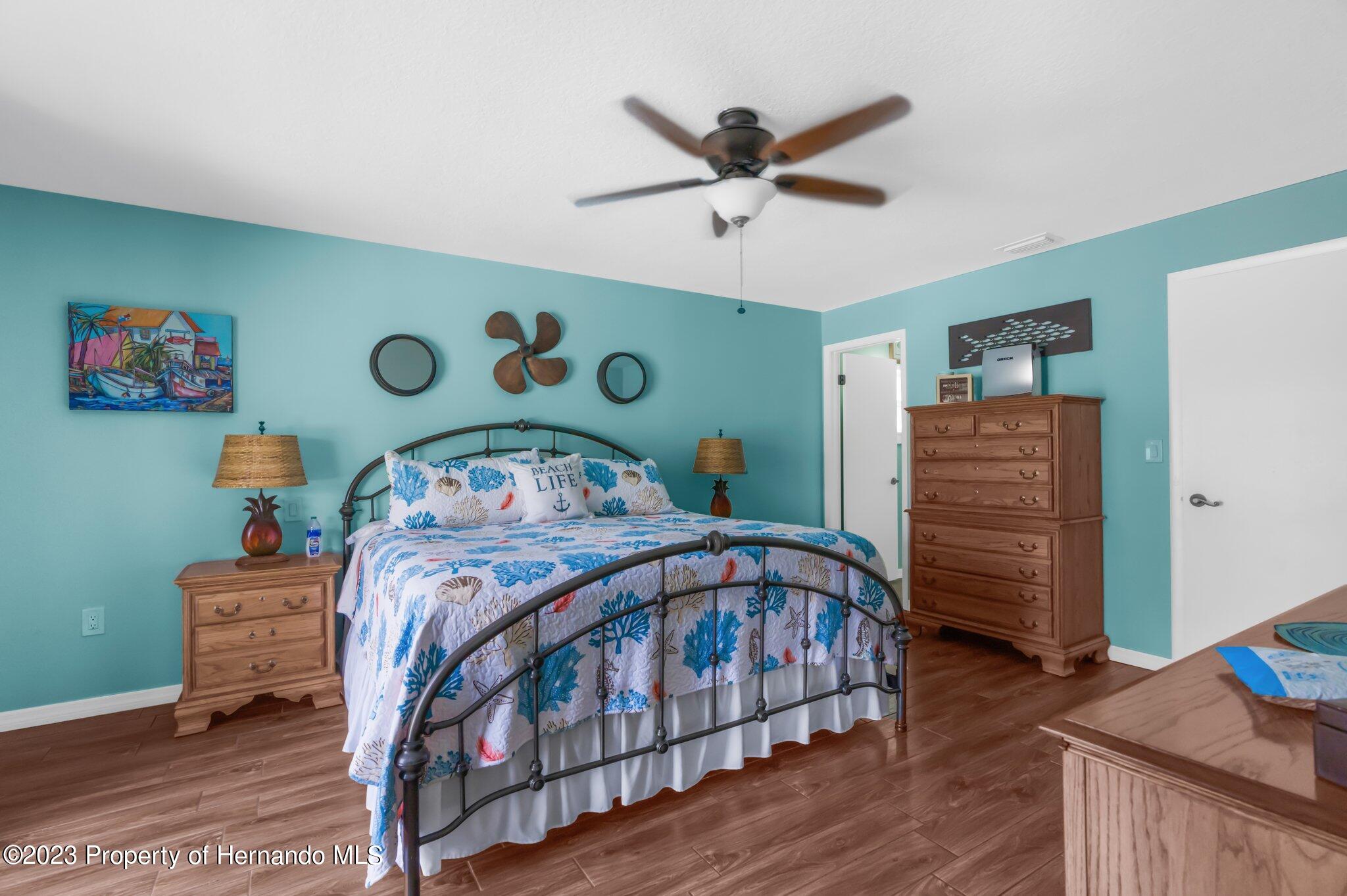 5396 Fern Weeki Wachee, FL 34607 - Photo 25 of 43 a bedroom with a bed and a view of walk in closet