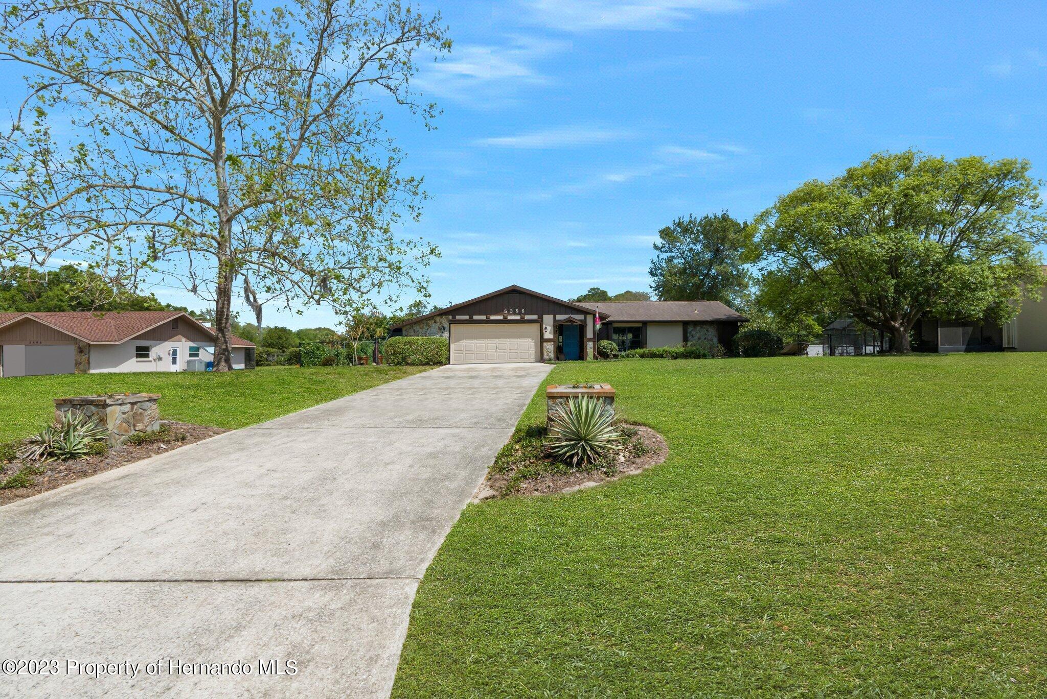 5396 Fern Weeki Wachee, FL 34607 - Photo 3 of 43 a view of a house with a yard