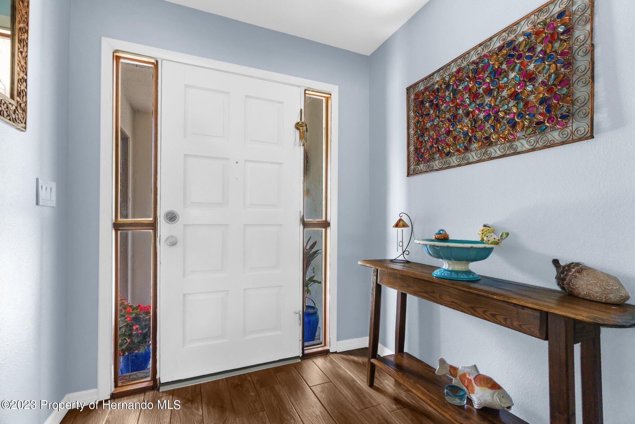 5396 Fern Weeki Wachee, FL 34607 - Photo 6 of 43 a room with a table and chairs