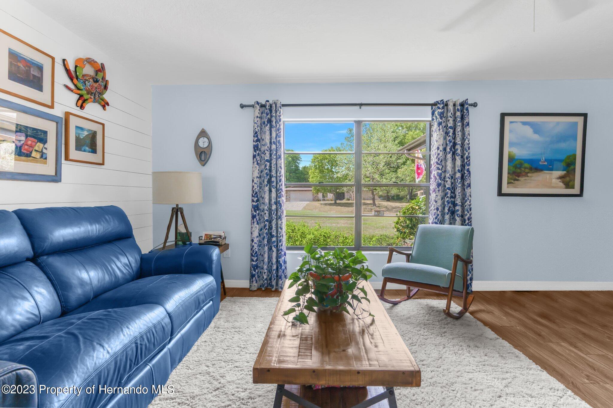 5396 Fern Weeki Wachee, FL 34607 - Photo 8 of 43 a living room with furniture and a large window