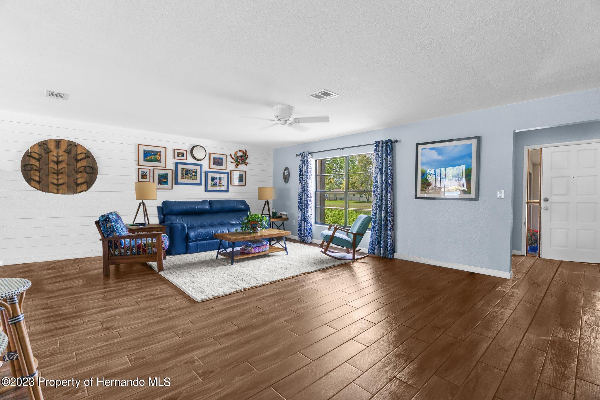 5396 Fern Weeki Wachee, FL 34607 - Photo 10 of 43 a living room with furniture and wooden floor