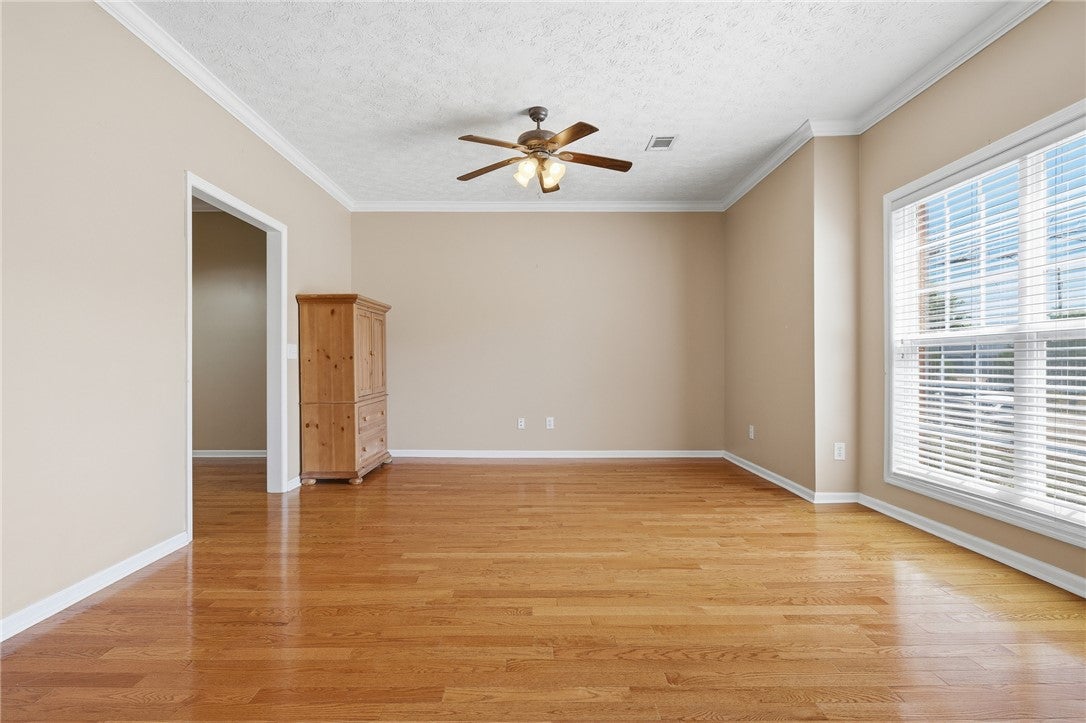 1213 North Dean Road Auburn, AL 36830 - Photo 4 of 18 This versatile living area features warm wood flooring and abundant natural light.