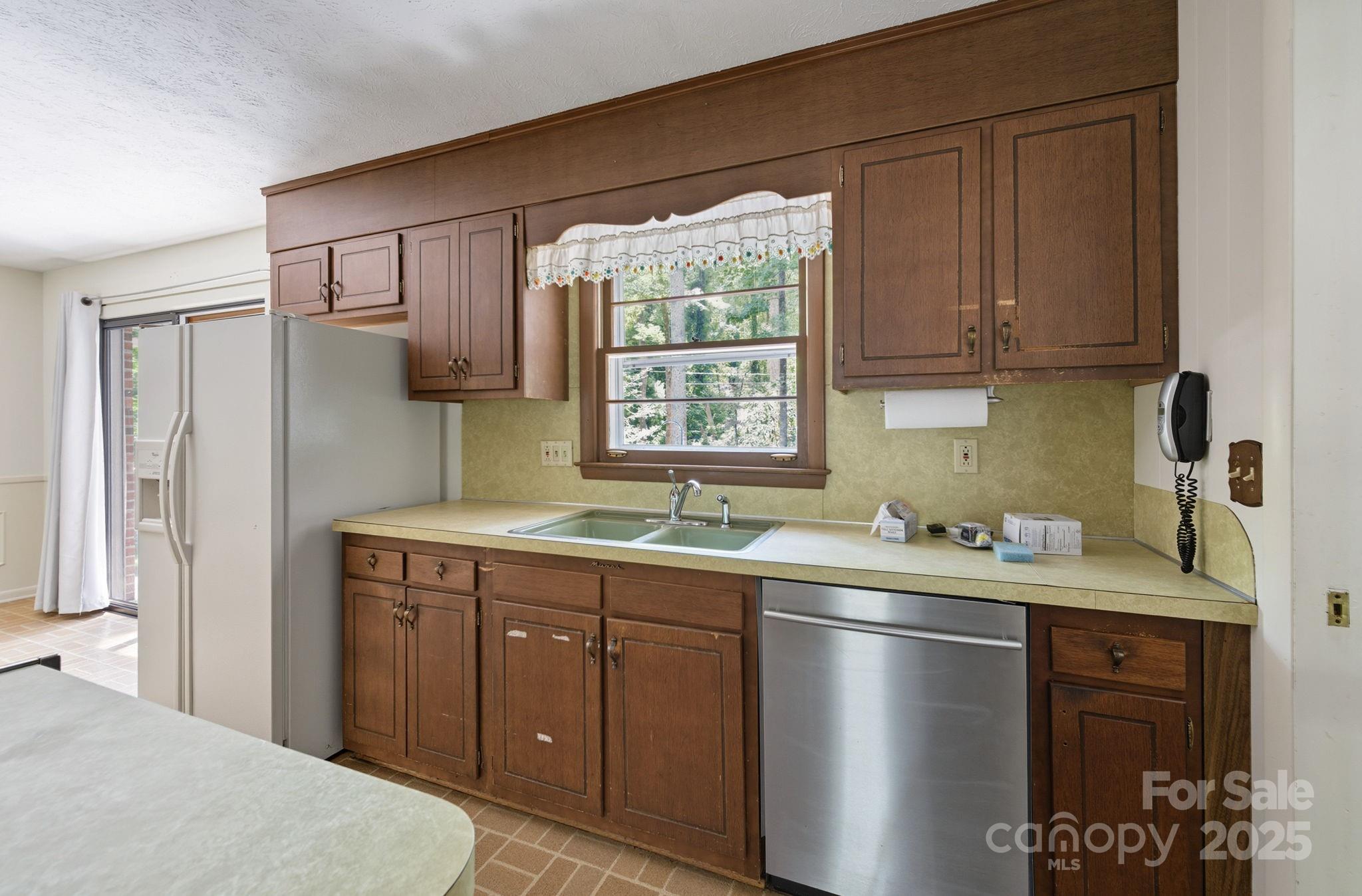 109 Rusty Lane Hendersonville, NC 28791 - Photo 13 of 34 a kitchen with a sink window and cabinets