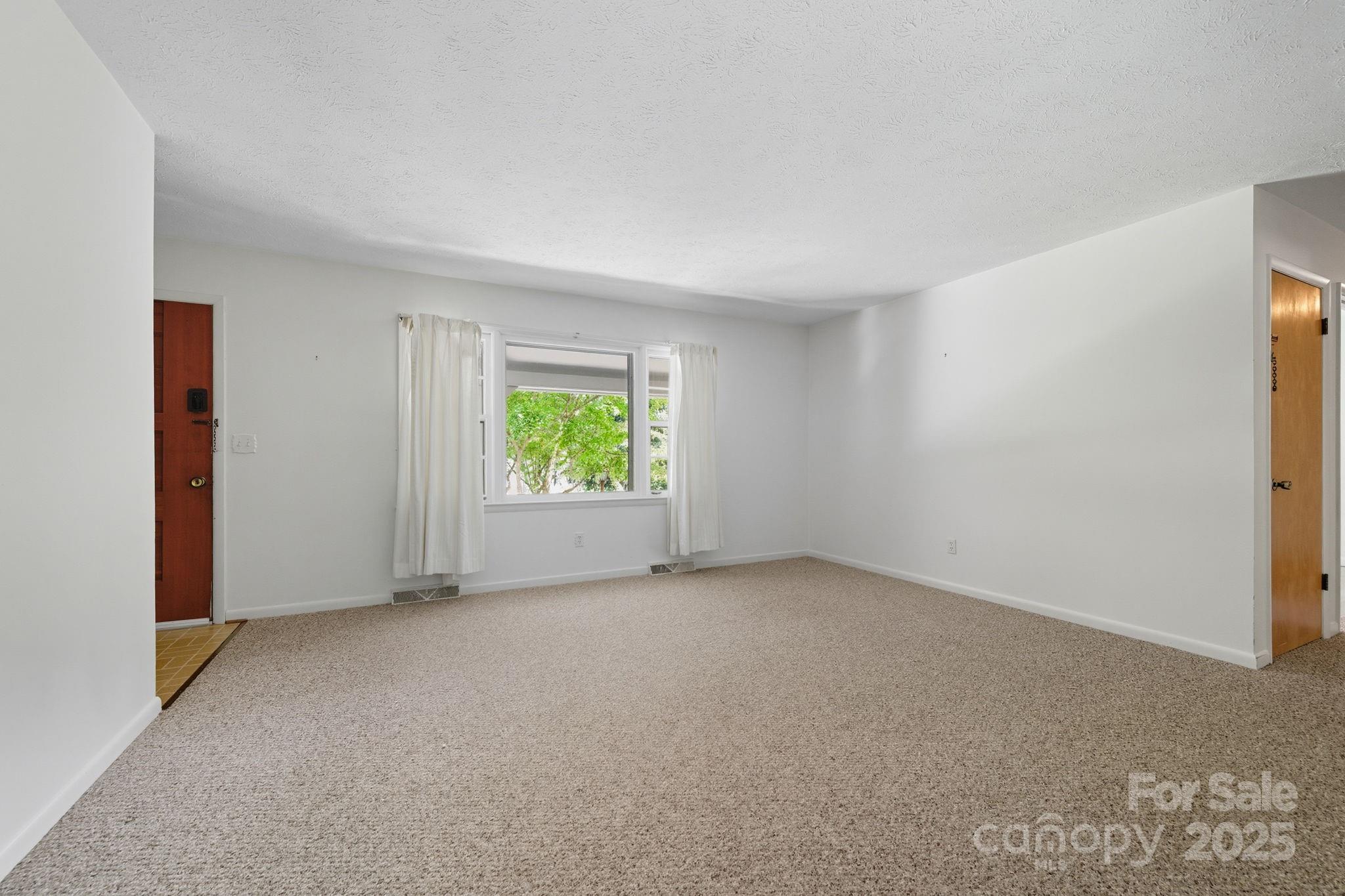 109 Rusty Lane Hendersonville, NC 28791 - Photo 17 of 34 an empty room with windows