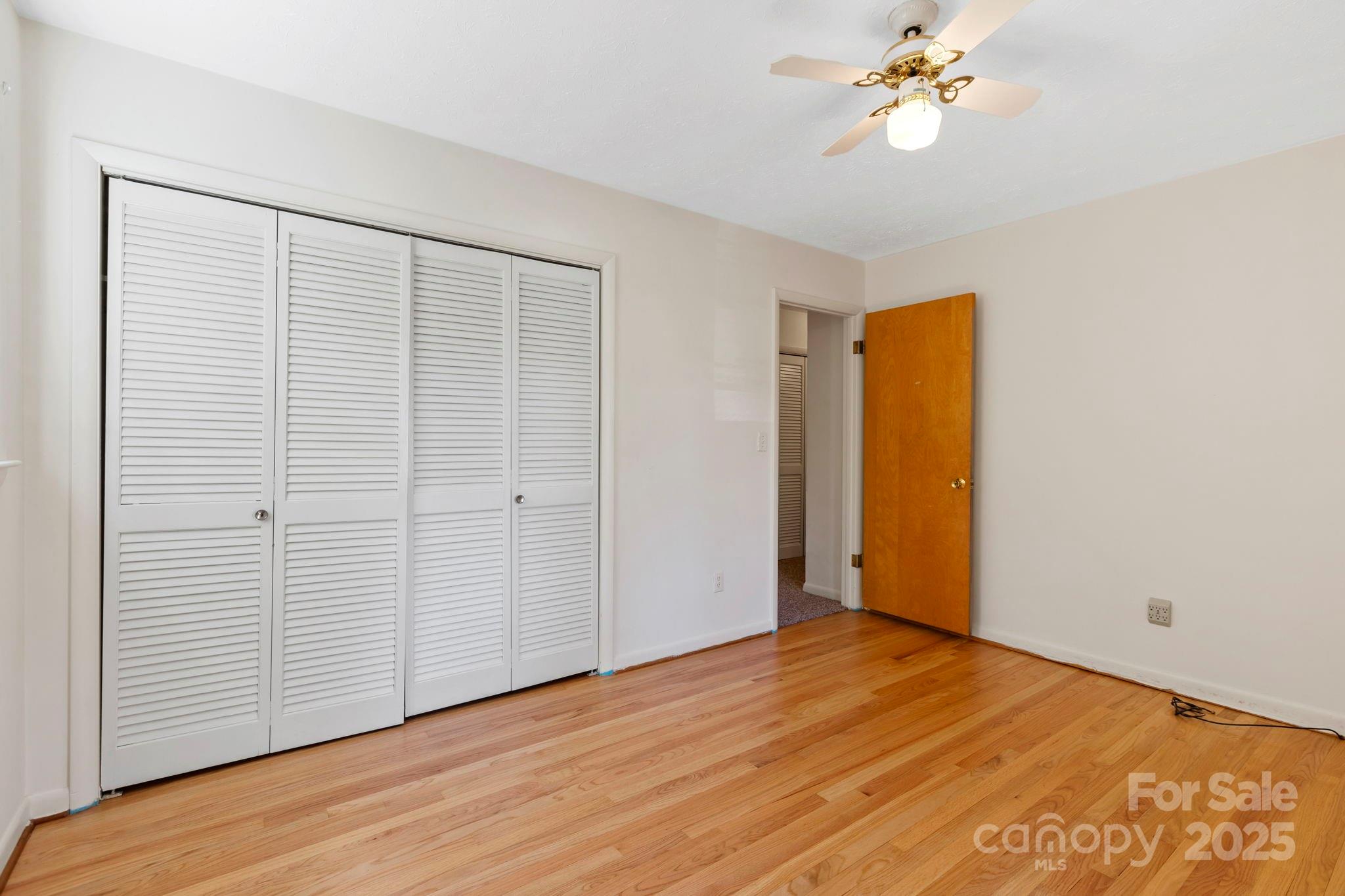 109 Rusty Lane Hendersonville, NC 28791 - Photo 22 of 34 a view of an empty room with wooden floor