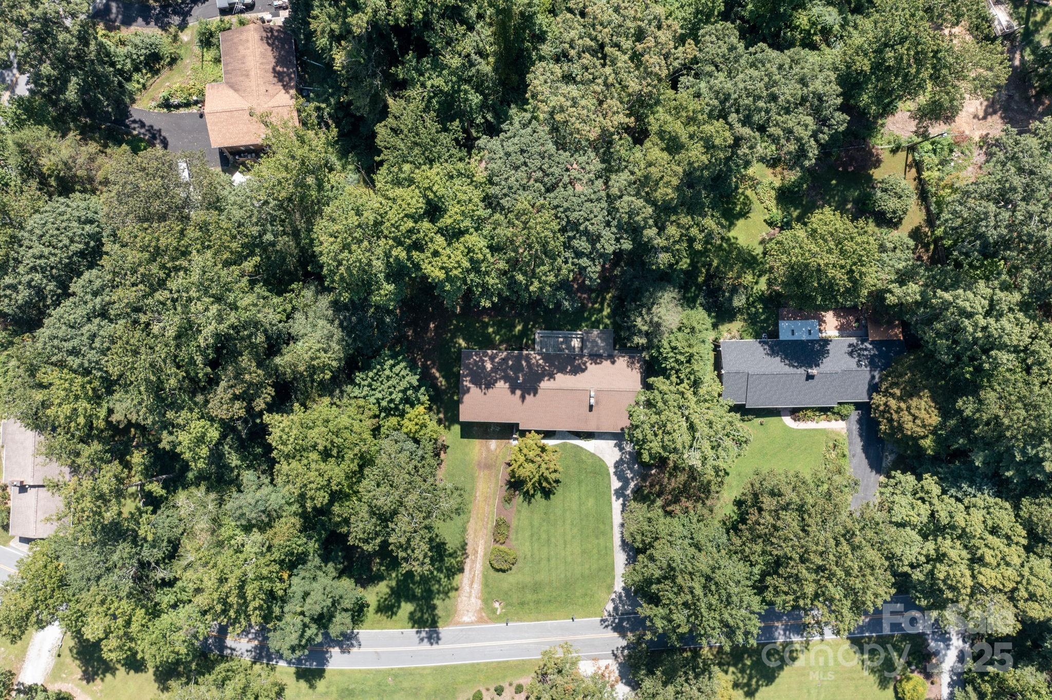 109 Rusty Lane Hendersonville, NC 28791 - Photo 30 of 34 an aerial view of a house with a yard