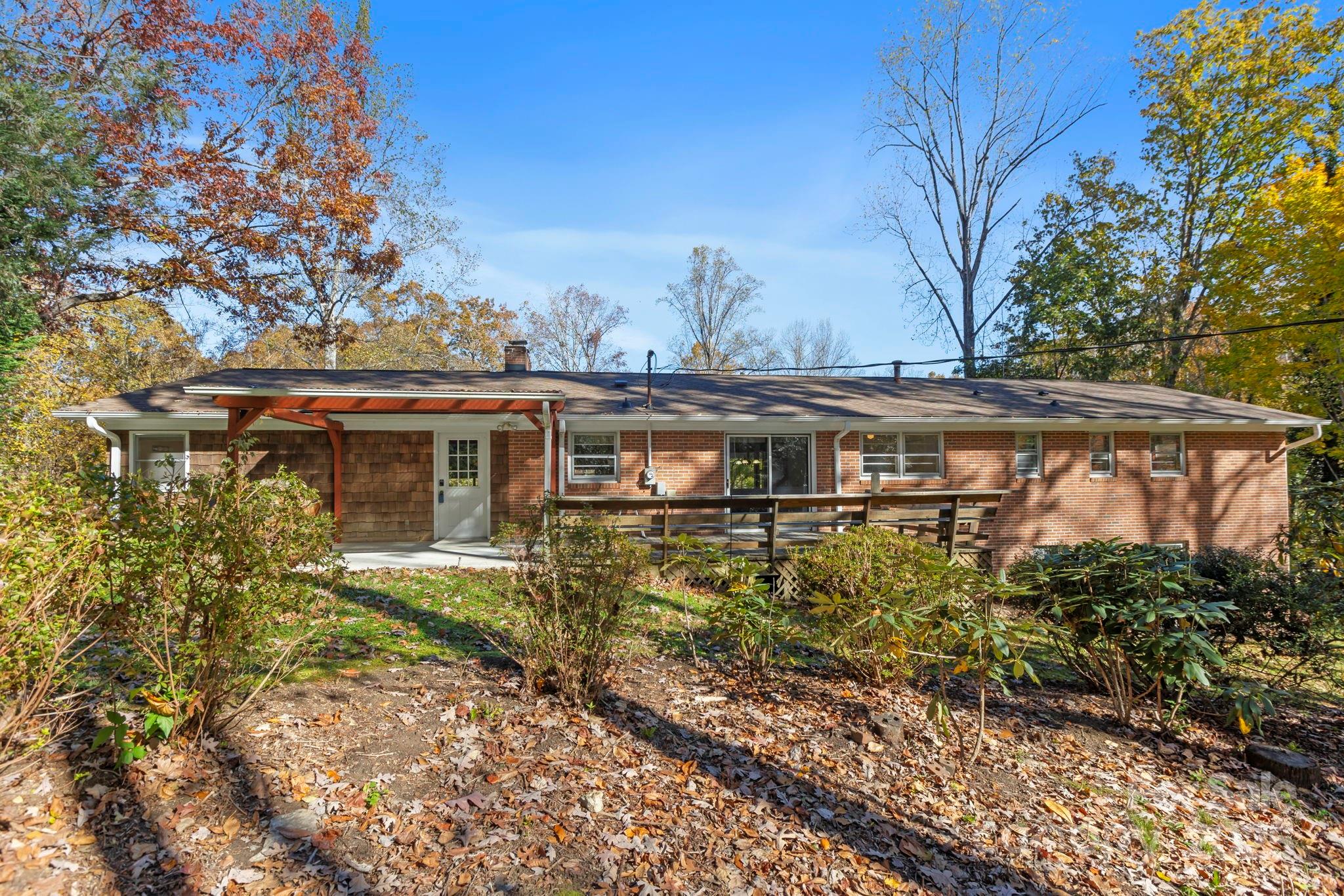 109 Rusty Lane Hendersonville, NC 28791 - Photo 5 of 34 a aerial view of a house with a yard and balcony