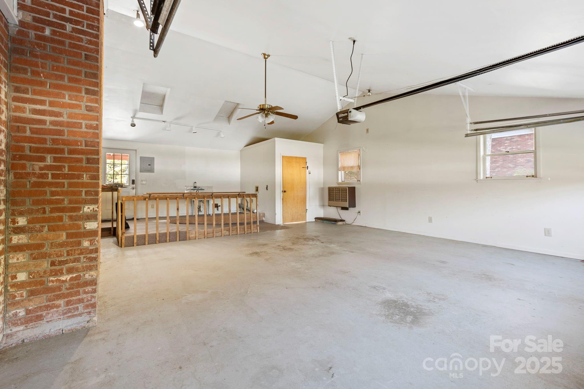 109 Rusty Lane Hendersonville, NC 28791 - Photo 7 of 34 a view of a livingroom with a flat screen tv