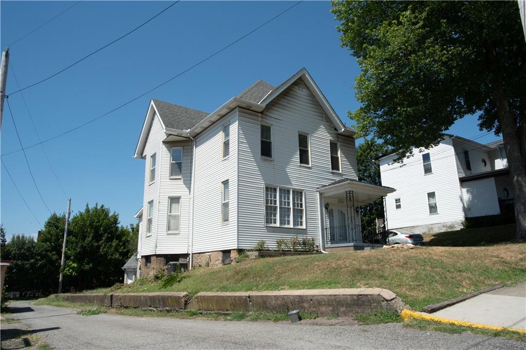 166 Pennsylvania Avenue Rochester, PA 15074 - Photo 29 of 30 a front view of a house with a yard