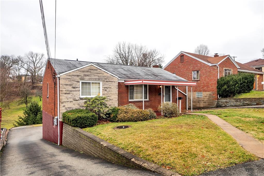 3512 Willett Road Pittsburgh, PA 15227 - Photo 3 of 23 a front view of a house with a yard