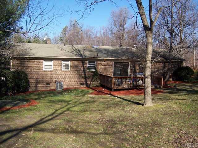 424 Reade Drive Roxboro, NC 27573 - Photo 4 of 10 Rear view of home showing deck, ideal for enjoying the backyard view and relaxing