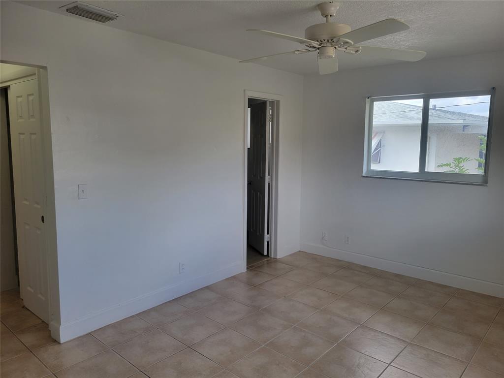 600 South Luna Court, Unit 29 Hollywood, FL 33021 - Photo 5 of 13 an empty room with windows and fan